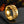 Roman Chain Techwear Ring in gold-tone, side view of the chain band against a blurred warm background