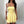 Ruched Bandeau Y2K Dress in yellow, front view with a cream shoulder bag against a white wall