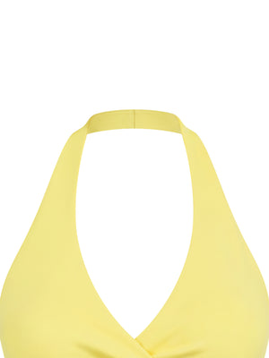 Close-up of the yellow halter neck strap and the V neckline of the ruched yoga tank top