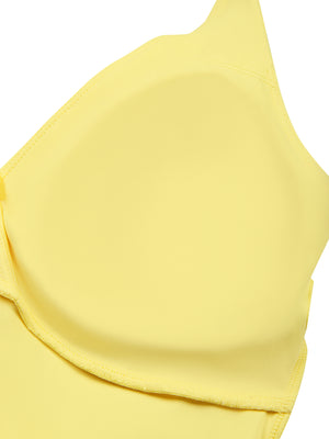 Inside view of the yellow ruched halter top at the bust, showing the shaped cup lining and the stitched seam