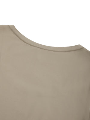 Close-up of the Khaki shoulder and neckline seam on the nylon and spandex bodysuit, smooth flat finish