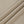Folds of the Khaki nylon and spandex fabric, a smooth matte stretch knit used for the whole bodysuit