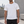 Man in the White Side Panel Athletic T Shirt, front view outdoors with a small gray chest logo