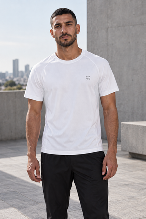 Man in the White Side Panel Athletic T Shirt, front view outdoors with a small gray chest logo