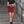 Wine Red side slit tennis skirt worn on graffiti stairs with a black crop tee, front view of the stripe trim