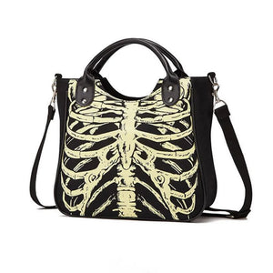 Black tote bag with a pale skeleton ribcage print and a detachable shoulder strap