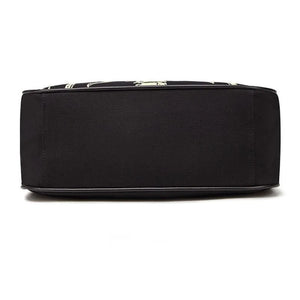 Black tote bag with a pale skeleton ribcage print and a detachable shoulder strap