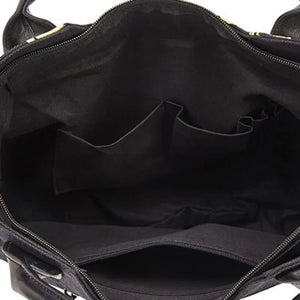 Black tote bag with a pale skeleton ribcage print and a detachable shoulder strap