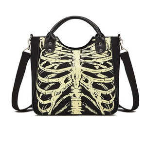Black tote bag with a pale skeleton ribcage print and a detachable shoulder strap