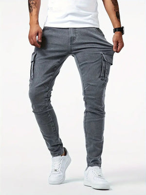 Gray stretch denim cargo jeans with a white tee, front view of the narrow leg down to white sneakers