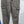Gray cargo jeans on a hanger, close view of the zip fly, side flap pockets and light distressed marks