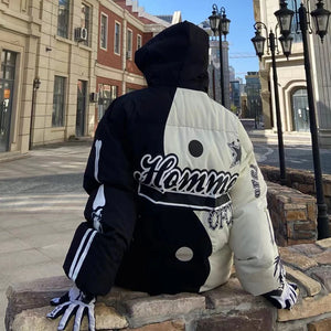 Padded hooded parka with a skeleton patchwork print across the sleeves and body