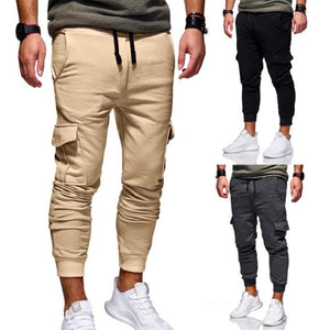 Slim cargo-joggingbukser til træning i khaki set forfra, med små indsatte billeder af den sorte og mørkegrå udgave