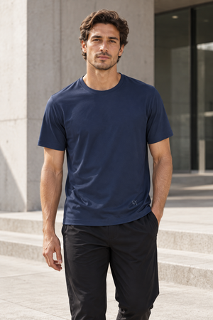 Navy Blue slim fit gym t-shirt worn front walking view, crew neck and small logo near the hem