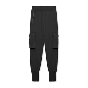 Classic Black slim fit techwear joggers alone, front view with a red-trimmed zipped hip pocket and long ankle cuffs