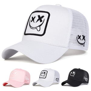 White trucker cap with an XX smiley face patch and mesh back