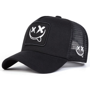 White trucker cap with an XX smiley face patch and mesh back