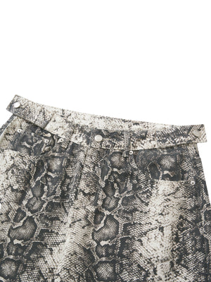Close-up of the waistband and zip fly, the button sitting flush against the printed cotton