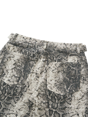 Close-up of the back pockets, stitched flat with the snake pattern matched across the seam