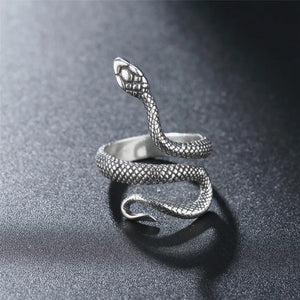Snake Python Gothic Ring in silver-tone, coiled scaled serpent standing on a grey textured surface