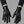 Snakeskin Pattern Techwear Winter Gloves worn by a person, close-up on both hands, front view on a grey studio background