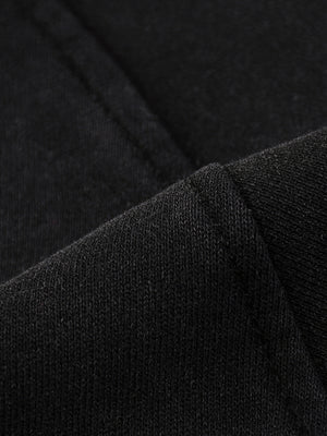 Close-up of the cotton on the Snow Washed Gothic Hooded Vest, loop-back knit beside a flat seam