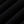 Folds of the heavy cotton laid across each other, showing the depth of the washed black