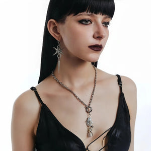 Stainless steel spike star earrings on a hoop with a dangling spike