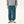 Teal blue pants worn with a grey hoodie and sneakers, front view, relaxed leg gathered at the ankle