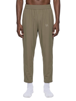 Khaki straight leg athletic pants worn front view on a white background, ankle length hem over white socks