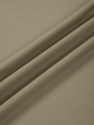 Close-up of the Khaki nylon and spandex knit used for the straight leg athletic pants, smooth surface