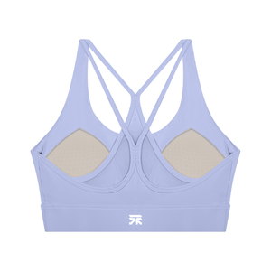 Lavender sports bra seen from the back, showing the strap cross, the mesh panel and both cup pads