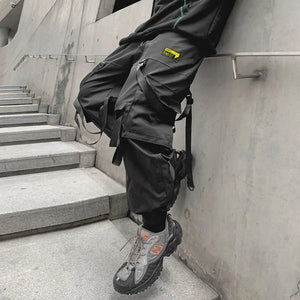 Pantalon noir patchwork à banderoles