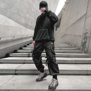 Pantalon noir patchwork à banderoles