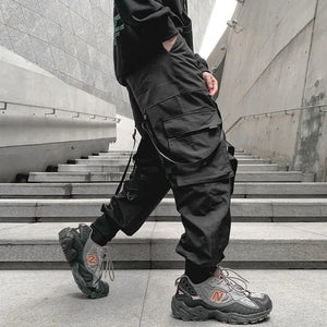 Pantalon noir patchwork à banderoles