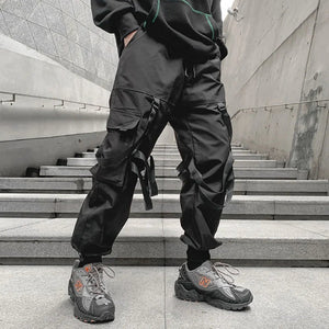 Pantalon noir patchwork à banderoles