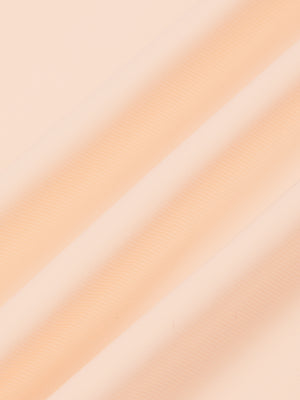 Close-up of the Light Pink nylon and spandex fabric of the training t-shirt, fine knit lines