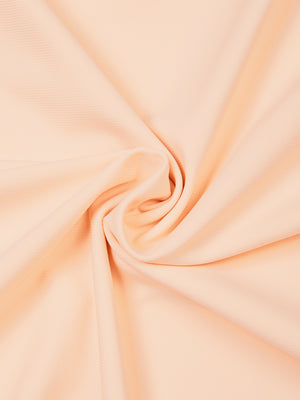 Twisted swatch of the Light Pink nylon and spandex knit used for the slim fit training t-shirt