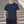 Navy Blue slim fit training t-shirt on a man outdoors, front view with a hand in the pocket