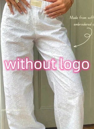Close view of the white eyelet Striped Wide Leg Y2K Pants, embroidered texture and elastic waist