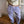 Lavender purple striped baggy pants with an elastic waist, front close-up worn with a cream top