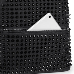Black canvas backpack covered in black cone studs with a double zip closure