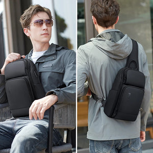 Black sling bag sized for a 7.9 inch tablet with a wide chest strap