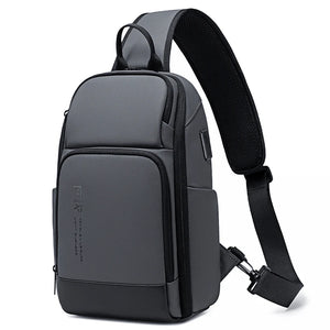 Black sling bag sized for a 7.9 inch tablet with a wide chest strap