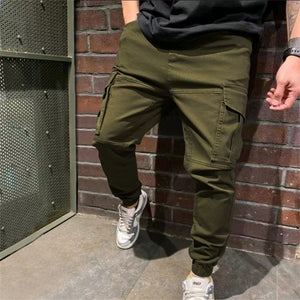 Army green Tapered Cargo Jogger Pants, model in sneakers, large flap cargo pocket and cuffed ankle
