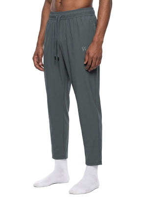 Dark Gray tapered pants in a three-quarter front view on a model, side pocket and small thigh logo