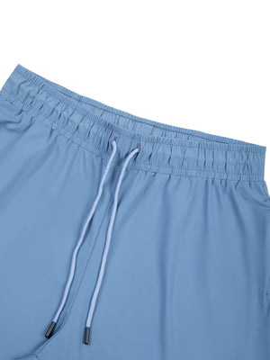 Close-up of the Blue waistband, elastic band with a white drawstring and black cord tips