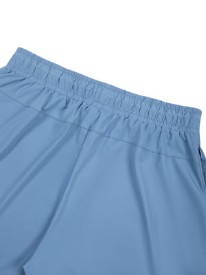 Close-up of the Blue elastic waistband from the back, gathered band stitched to the smooth knit