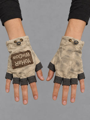 Techwear Fingerless Patchwork Gloves worn by a person, close-up on both hands, front view on a grey studio background
