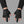 Techwear Fingerless Tactical PU Leather Gloves worn by a person, close-up on both hands, front view on a grey studio backgrou